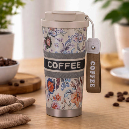 Beige floral insulated coffee travel tumbler with lid by Kaari Tales, designed for hot beverages on the go.