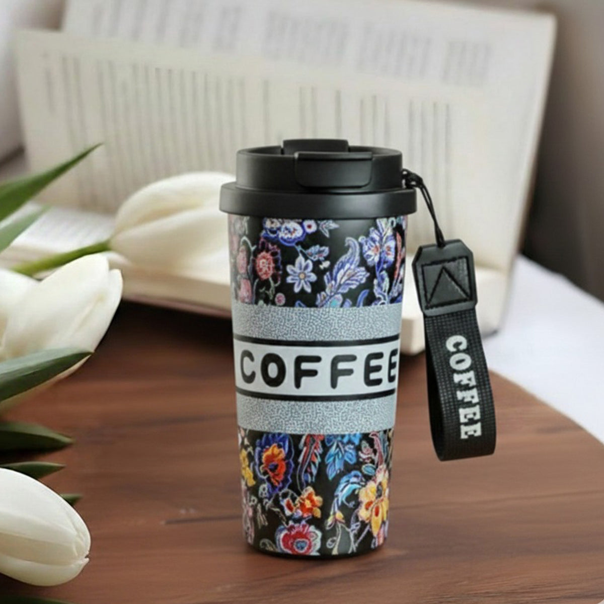 Kaari Tales floral insulated coffee travel mug with lid, black exterior and colorful floral design, ideal for hot beverages on the go