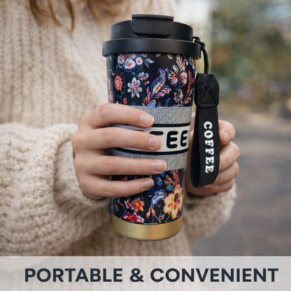 Kaari Tales floral insulated coffee tumbler with lid, black mug featuring colorful floral design, ideal for travel and hot beverages.
