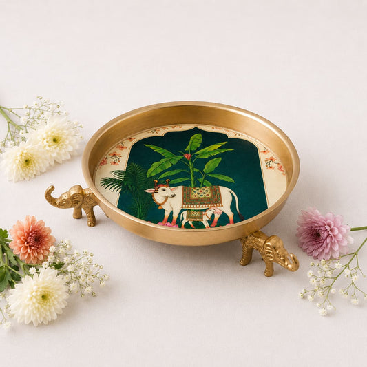 KaariTales Kamadhenu Nature's Grace Urli featuring intricate traditional design in brass with a polished finish.