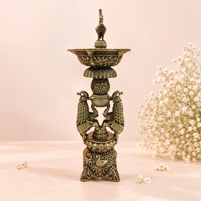 Handcrafted brass Gaja Mayura lamp with peacock and elephant designs, traditional oil lamp for puja and festive home décor.