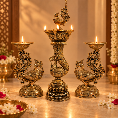 Set of two handcrafted brass peacock diyas by Kaari Tales, traditional oil lamps for puja, festive decor, and gifting.